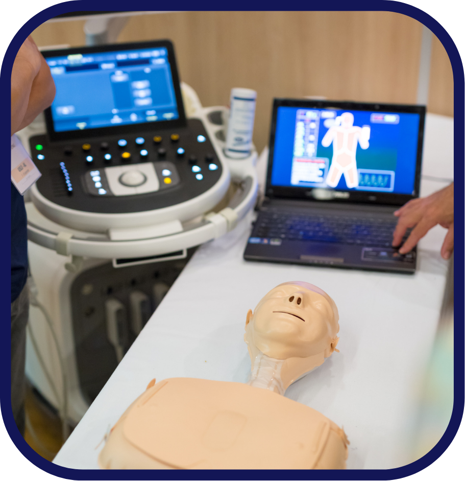 Healthcare professional and educator utilizing ultrasound in a simulation lab
